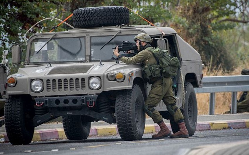 Five soldiers wounded by mortar near southern Israeli community
