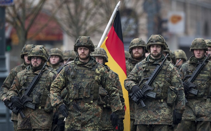 German defense minister says Berlin should increase military spending