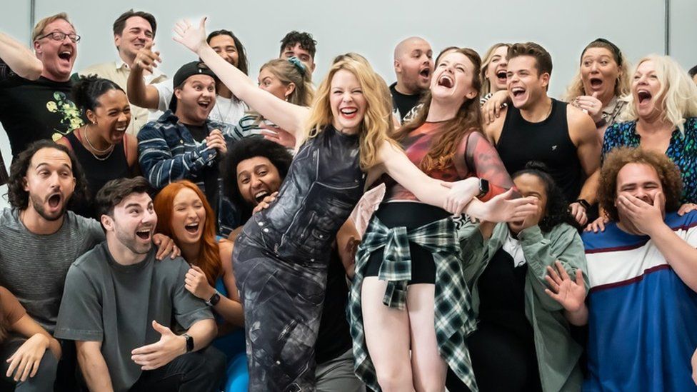 Kylie Minogue surprises cast with visit to musical rehearsals