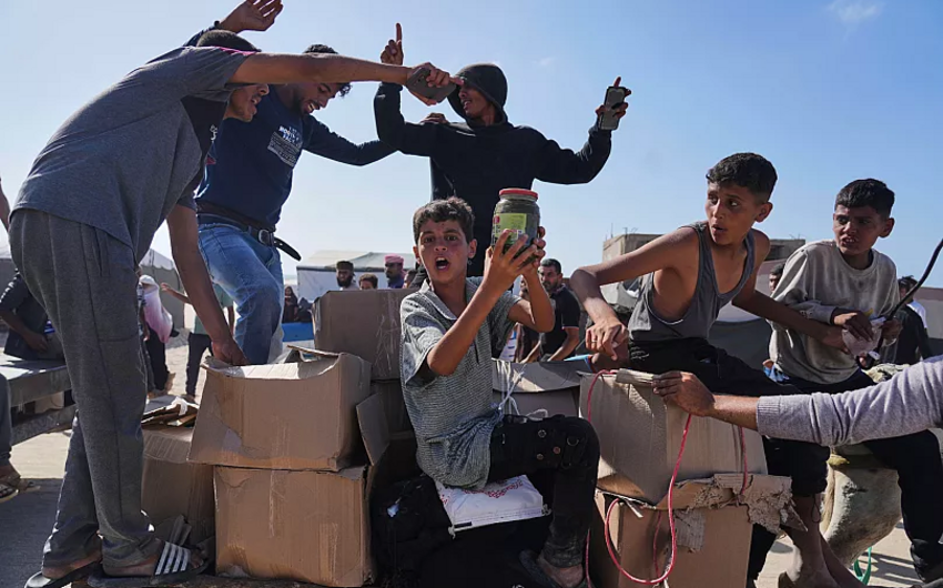 US contractors say their colleagues are firing live ammo as Palestinians seek food in Gaza
