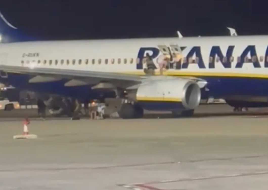 At least 18 people injured after fire alert on Ryanair plane in Majorca as passengers abandon jet &amp; leap from wing