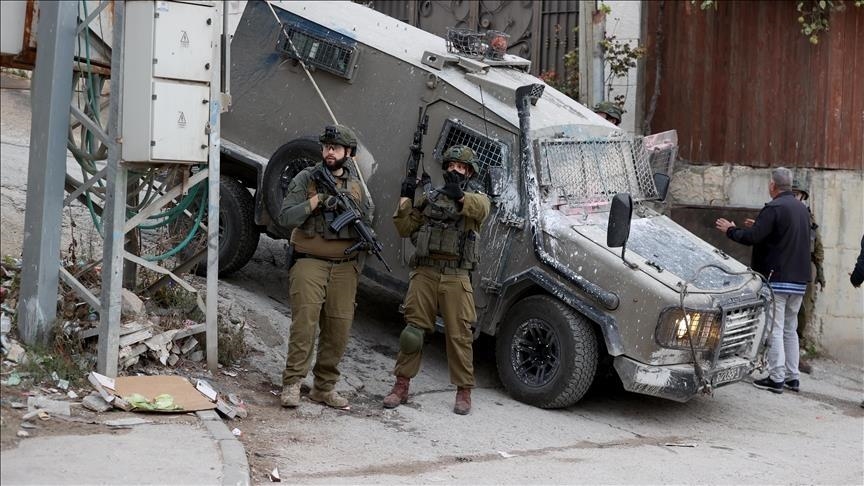 Palestinian man shot dead after stabbing Israeli soldier during West Bank raid